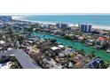 Coastal property shown in an aerial view, highlighting its waterfront location and beach proximity at 515 S Washington Dr, Sarasota, FL 34236