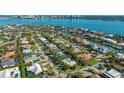 Aerial view of the neighborhood showcasing waterfront homes and views of the city at 435 Partridge Cir, Sarasota, FL 34236