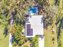 Aerial view of home with solar panels and pool at 2910 49Th St, Sarasota, FL 34234