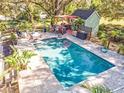 Inviting pool area with a large pool and outdoor kitchen at 2910 49Th St, Sarasota, FL 34234