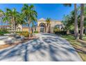 Two-story house with circular driveway, fountain, and palm trees at 6779 Ashley Ct, Sarasota, FL 34241