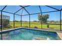 Screened-in pool with golf course view at 10643 Old Grove Cir, Bradenton, FL 34212