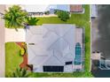 High-angle view of single-Gathering home with pool and canal-side dock at 4440 Tatum St, Port Charlotte, FL 33948