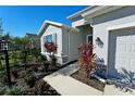 Two-story house with gray siding, landscaping, and a two-car garage at 16721 Barnwood Pl, Bradenton, FL 34211