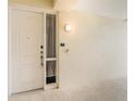 Front door entrance with security features and sidelights at 7840 34Th W Ave # 103, Bradenton, FL 34209