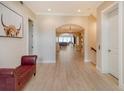 Bright and spacious entryway with hardwood floors and a view to the living room at 2412 Bay Dr W Ave, Bradenton, FL 34207