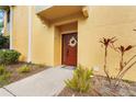 Inviting exterior with a charming entrance and well-maintained landscaping at 4990 Baraldi Cir # 101, Sarasota, FL 34235