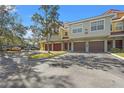 Townhomes with red and brown garage doors and parking at 4990 Baraldi Cir # 101, Sarasota, FL 34235