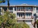 Two-story building, two units, balconies, and attached garage at 3816 6Th Ave, Holmes Beach, FL 34217