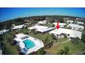 Aerial view showing a single-story home near a pool at 7315 8Th W Ave, Bradenton, FL 34209