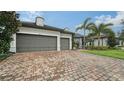 Two-car garage with brick paver driveway at 6839 Chester Trl, Bradenton, FL 34202