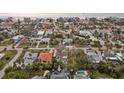 Gulf coast community featuring neighborhood streets, palm trees, pools, and beautiful homes at 745 Bruce Ave, Clearwater Beach, FL 33767