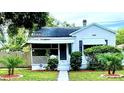 Quaint white bungalow home with a well-manicured lawn at 3642 Dartmouth N Ave, St Petersburg, FL 33713