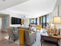 Open concept living room with hardwood floors and stunning ocean views at 1211 Gulf Of Mexico Dr # 408, Longboat Key, FL 34228