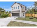 Modern two-story home with a two-car garage and a fenced yard at 2554 Arlington St, Sarasota, FL 34239