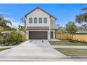 Modern two-story house with a two-car garage and fenced-in backyard at 2554 Arlington St, Sarasota, FL 34239