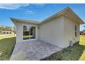 New construction home featuring a large patio with brick pavers at 1006 Hagle Park Rd, Bradenton, FL 34212