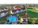 Aerial view showing the community pool, building, and golf course at 6059 Bahia Del Mar Blvd # 239, St Petersburg, FL 33715