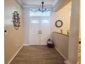 Bright and spacious entryway with tile flooring and double front doors at 13634 7Th Avenue Ne Cir, Bradenton, FL 34212