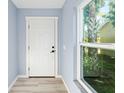 Bright entryway with white door and view to backyard at 206 Beacon Harbour Loop, Bradenton, FL 34212