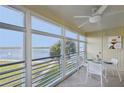 Spacious lanai with water views and seating for dining at 4440 Exeter Dr # N304, Longboat Key, FL 34228