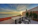 Relaxing terrace with bay views, perfect for enjoying wine at sunset at 4557 Bay Club Dr, Bradenton, FL 34210