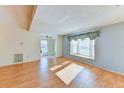 Bright living room with wood floors and a bay window at 5604 Garden Lakes Dr, Bradenton, FL 34203