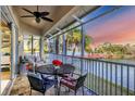 Relaxing screened balcony overlooking a lake with sunset views at 6503 Moorings Point Cir # 202, Lakewood Ranch, FL 34202