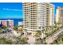 Luxury high-rise building with ocean view and palm trees at 35 Watergate Dr # 1203, Sarasota, FL 34236