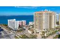 High-rise condo building near the water with other buildings and roads visible at 35 Watergate Dr # 1203, Sarasota, FL 34236