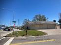 Commercial building with three garage doors and street view at 406 Laurel E Rd, Nokomis, FL 34275