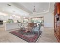 Open concept kitchen with island, stainless steel appliances, and white cabinets at 7168 Ryedale Ct, Sarasota, FL 34241