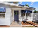 House entrance with a blue door and decorative accents at 2369 Browning St, Sarasota, FL 34237