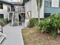 Condo building exterior with stairs and landscaping at 4445 46Th W Ave, Bradenton, FL 34210
