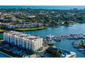 Aerial view of waterfront community with luxury condos and marina at 505 Tamiami N Trl # 201, Venice, FL 34285