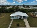 Aerial view of a single-story home with a large yard at 740 Floral Ln, Port Charlotte, FL 33952