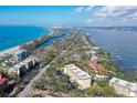 Aerial view showcasing condo building near the beach at 8625 Midnight Pass Rd # 505B, Sarasota, FL 34242