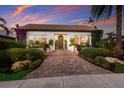 Beautiful Spanish style home with a welcoming entryway at sunset at 1923 Hibiscus St, Sarasota, FL 34239