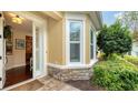 Welcoming entryway with hardwood floors and an open door to the interior at 3625 Tin Cup Blvd, Sarasota, FL 34232