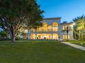 Back view of home showcasing backyard and patio at 749 Freeling Dr, Sarasota, FL 34242