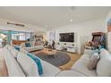 Relaxing living room with sectional sofa and large TV at 2069 Bougainvillea St, Sarasota, FL 34239