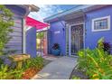 Inviting walkway leads to the home's entrance, featuring lush greenery at 3219 S East Ave, Sarasota, FL 34239