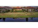 Home nestled on a tranquil waterway with lush landscaping at 4730 Zeno Ct, Bradenton, FL 34211
