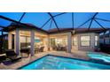 Inviting outdoor oasis with a pool, spa, and covered patio at 4730 Zeno Ct, Bradenton, FL 34211