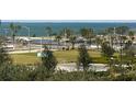 Waterfront property aerial view, featuring boats and lush green spaces at 800 N Tamiami Trl # 403, Sarasota, FL 34236