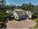 Luxury home with a large driveway and manicured landscaping at 85 Sugar Mill Dr, Osprey, FL 34229