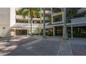 Building entrance with brick paved courtyard at 1932 Harbourside Dr # 232, Longboat Key, FL 34228