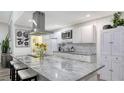 Modern kitchen with large island and granite countertops at 4720 Oak Forest W Dr # 57, Sarasota, FL 34231