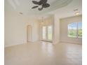 Bright living room with tile flooring,high ceilings, and a view to the entryway at 15124 Leipzig Cir, Port Charlotte, FL 33981