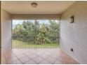 Screened balcony overlooking a lush green landscape at 5581 Key West Pl # 5581, Bradenton, FL 34203